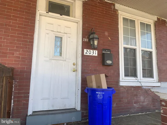 a bedroom with furniture and wooden floor