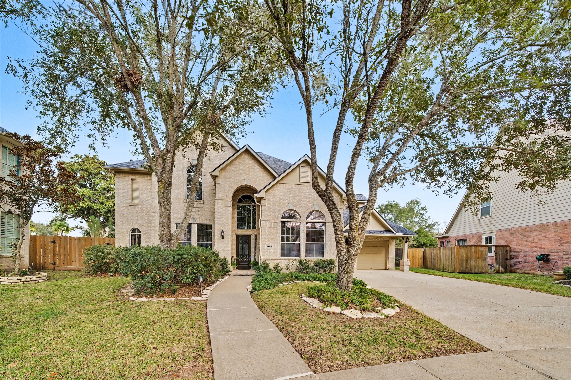 5403 Emerald Pointe Lane Sugar Land, TX 77479 - Photo 2 of 50 front view of a house with a yard