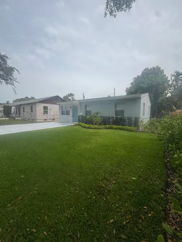 a bathroom with a double vanity sink toilet and shower