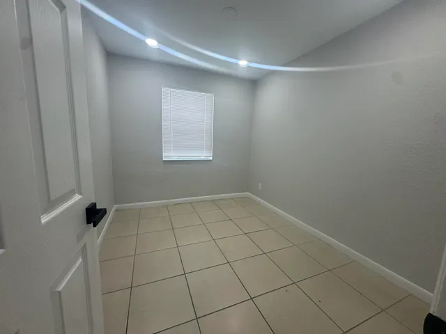 a view of an empty room and window