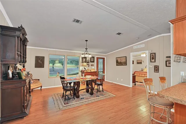 a backyard of a house with yard and outdoor seating
