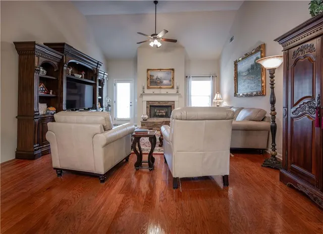 a living room with furniture and a fireplace