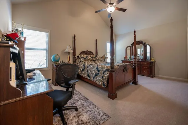 a bed room with furniture and a chandelier