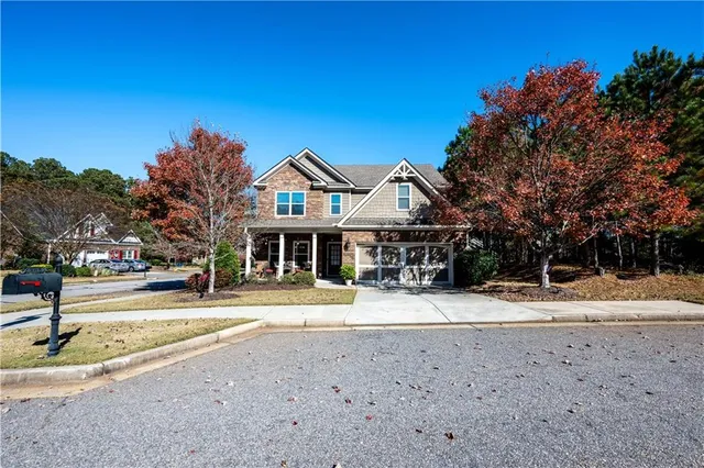 a front view of a house with a yard
