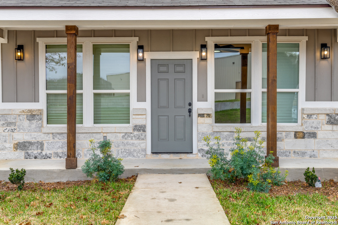 a front view of a house with a glass door