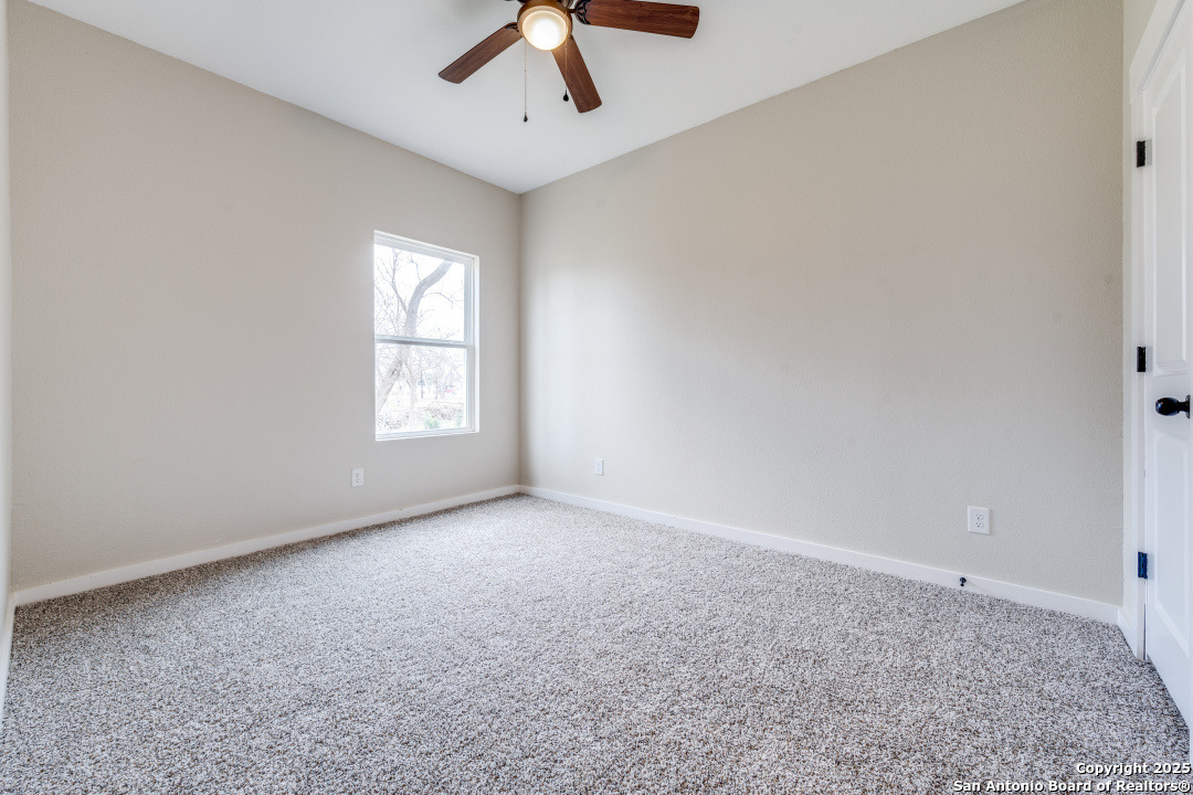 15935 Buchel LaCoste, TX 78039 - Photo 16 of 24 an empty room with windows and fan
