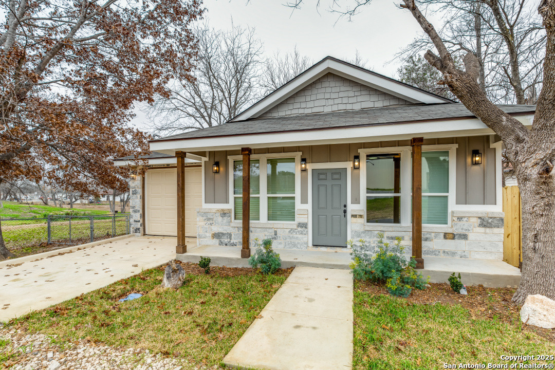 15935 Buchel LaCoste, TX 78039 - Photo 3 of 24 front view of a house with a yard
