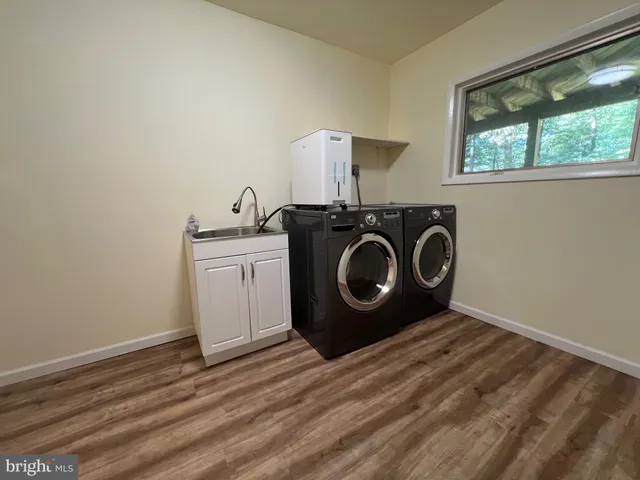 a utility room with a washing machine