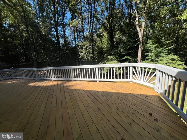 a view of balcony with wooden floor