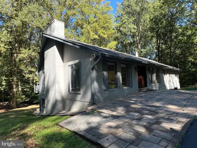 a backyard of a house with seating space
