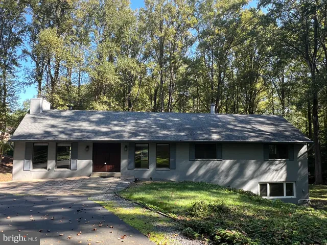 front view of a house with a garden
