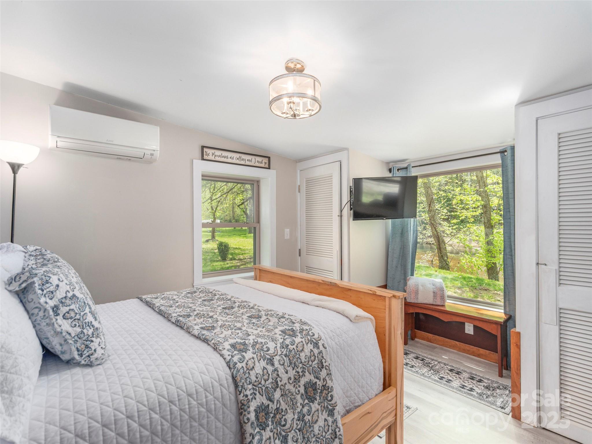 9386 Cruso Road Canton, NC 28716 - Photo 16 of 40 a bedroom with a bed and a window