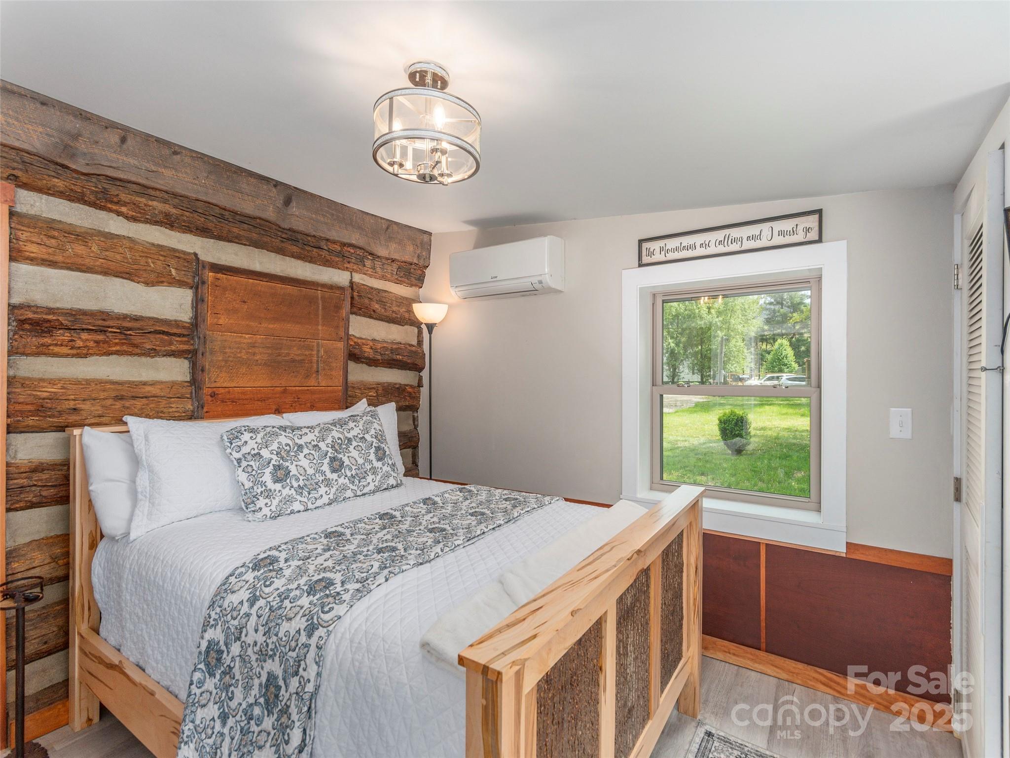 9386 Cruso Road Canton, NC 28716 - Photo 17 of 40 a bedroom with a bed and a window