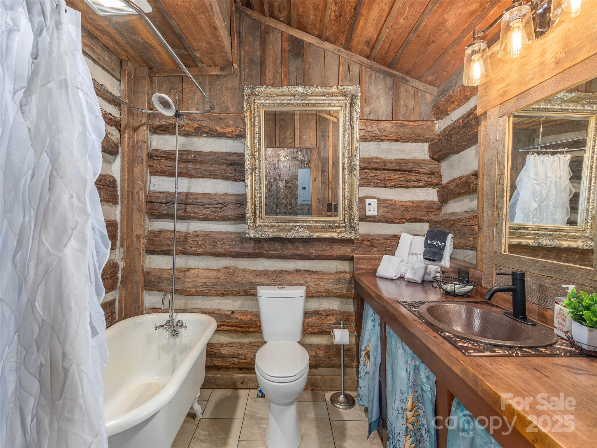 9386 Cruso Road Canton, NC 28716 - Photo 18 of 40 a bathroom with a granite countertop sink and a toilet