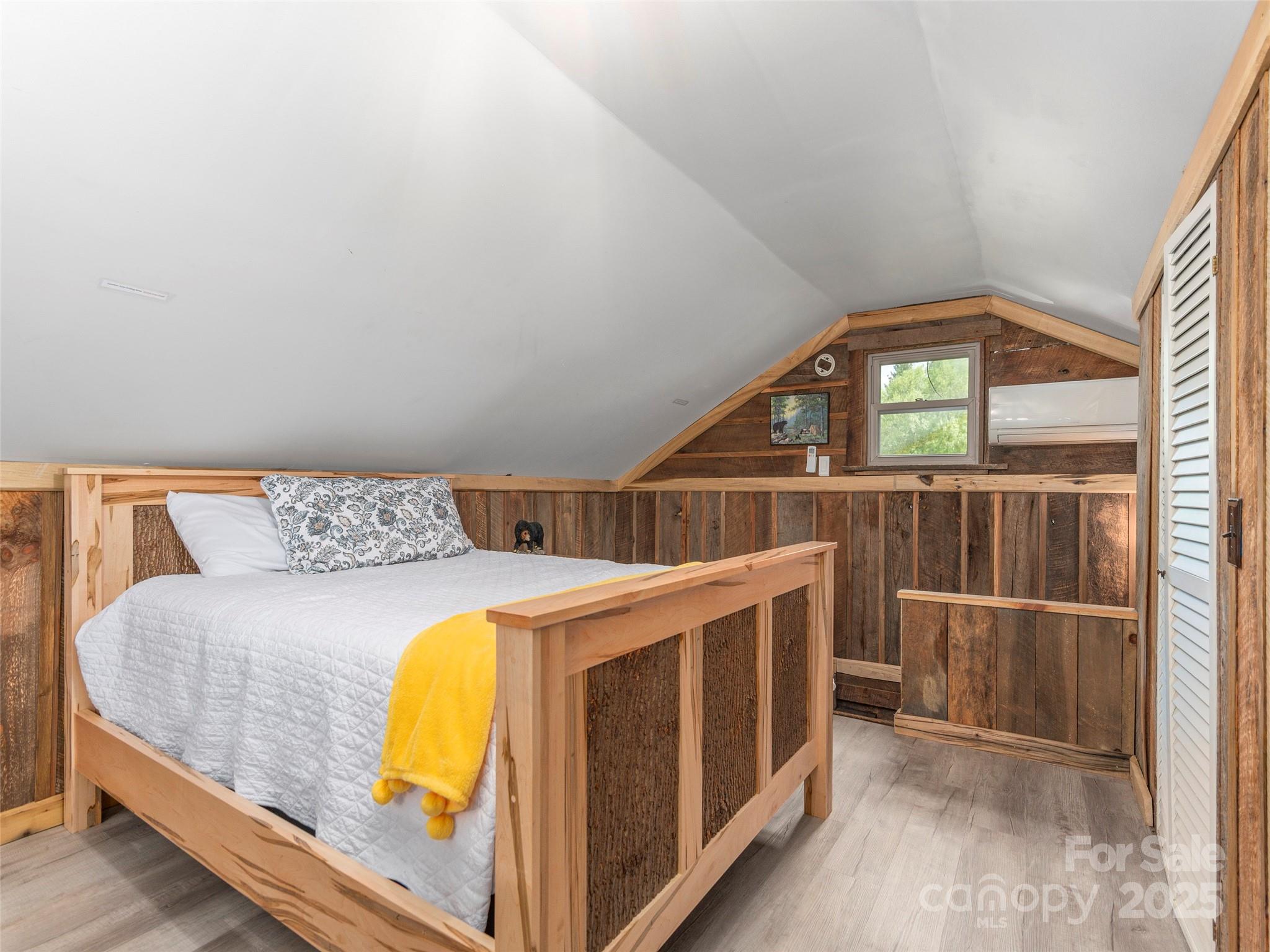 9386 Cruso Road Canton, NC 28716 - Photo 20 of 40 a bedroom with bed and a window