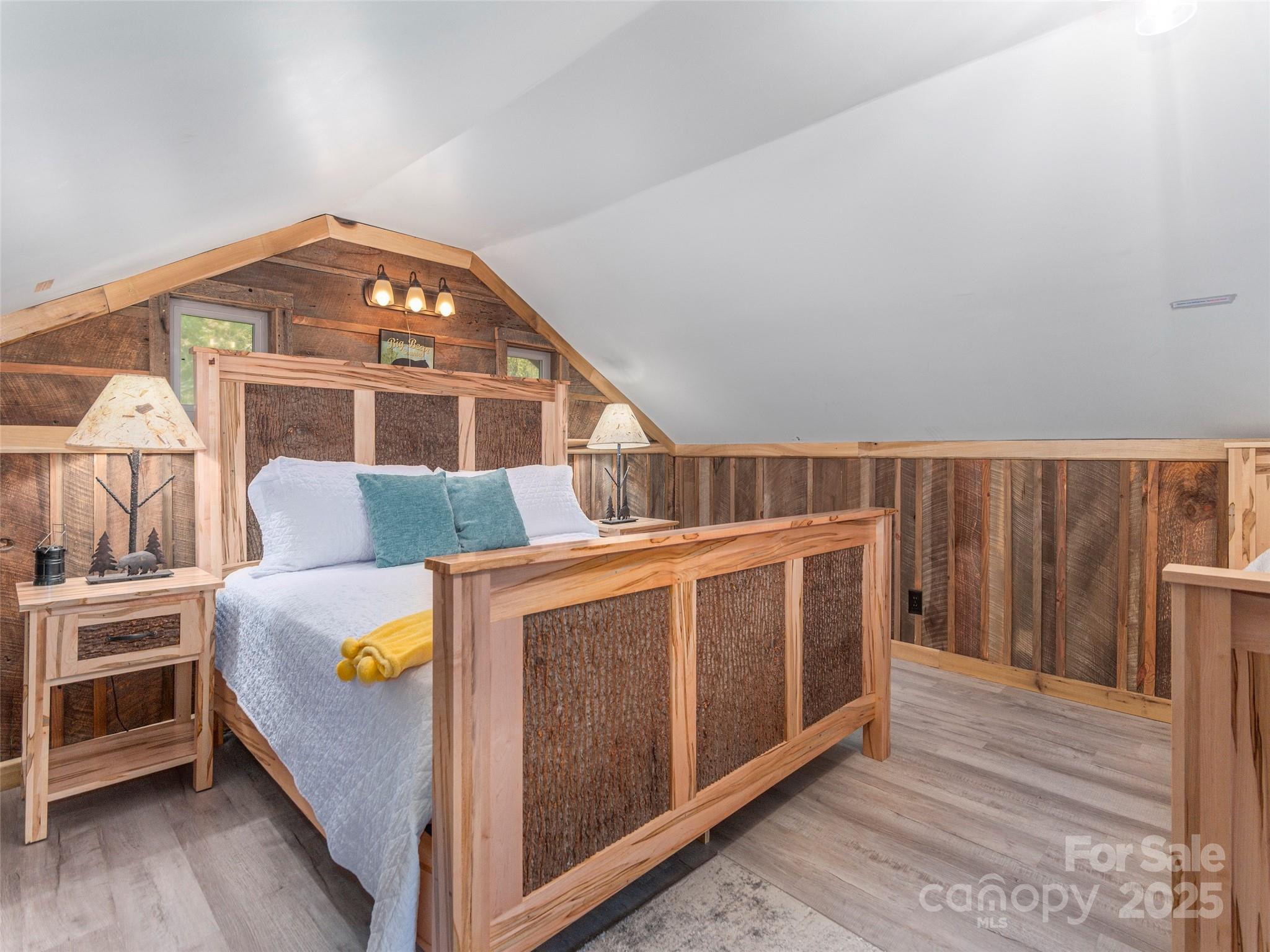 9386 Cruso Road Canton, NC 28716 - Photo 21 of 40 a view of a bedroom with furniture and wooden floor