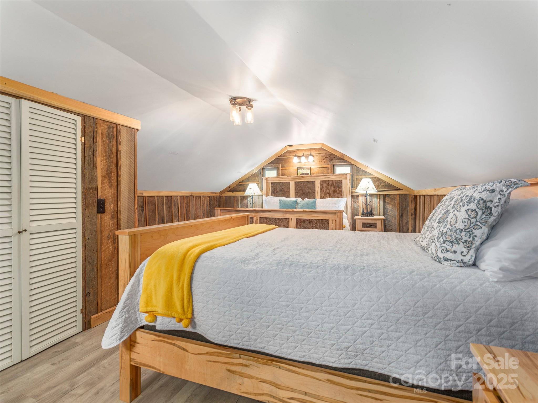 9386 Cruso Road Canton, NC 28716 - Photo 23 of 40 a bedroom with a large bed and a large window