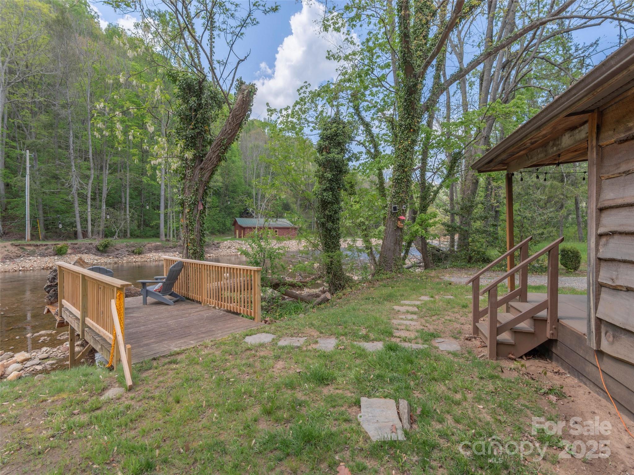 9386 Cruso Road Canton, NC 28716 - Photo 27 of 40 a view of a house with backyard and sitting area