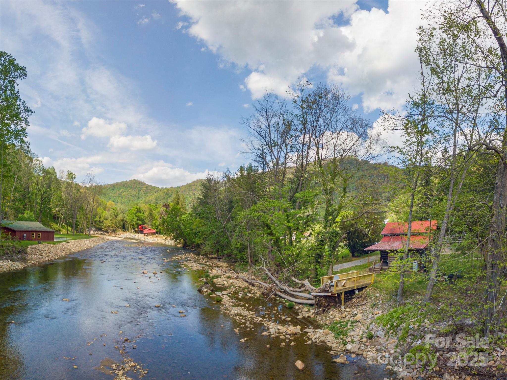 9386 Cruso Road Canton, NC 28716 - Photo 35 of 40 a view of a lake with beach and outdoor space