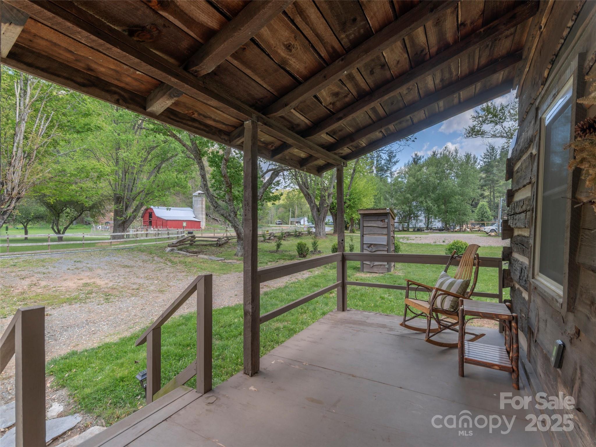 9386 Cruso Road Canton, NC 28716 - Photo 5 of 40 a view of yard with porch and outdoor seating