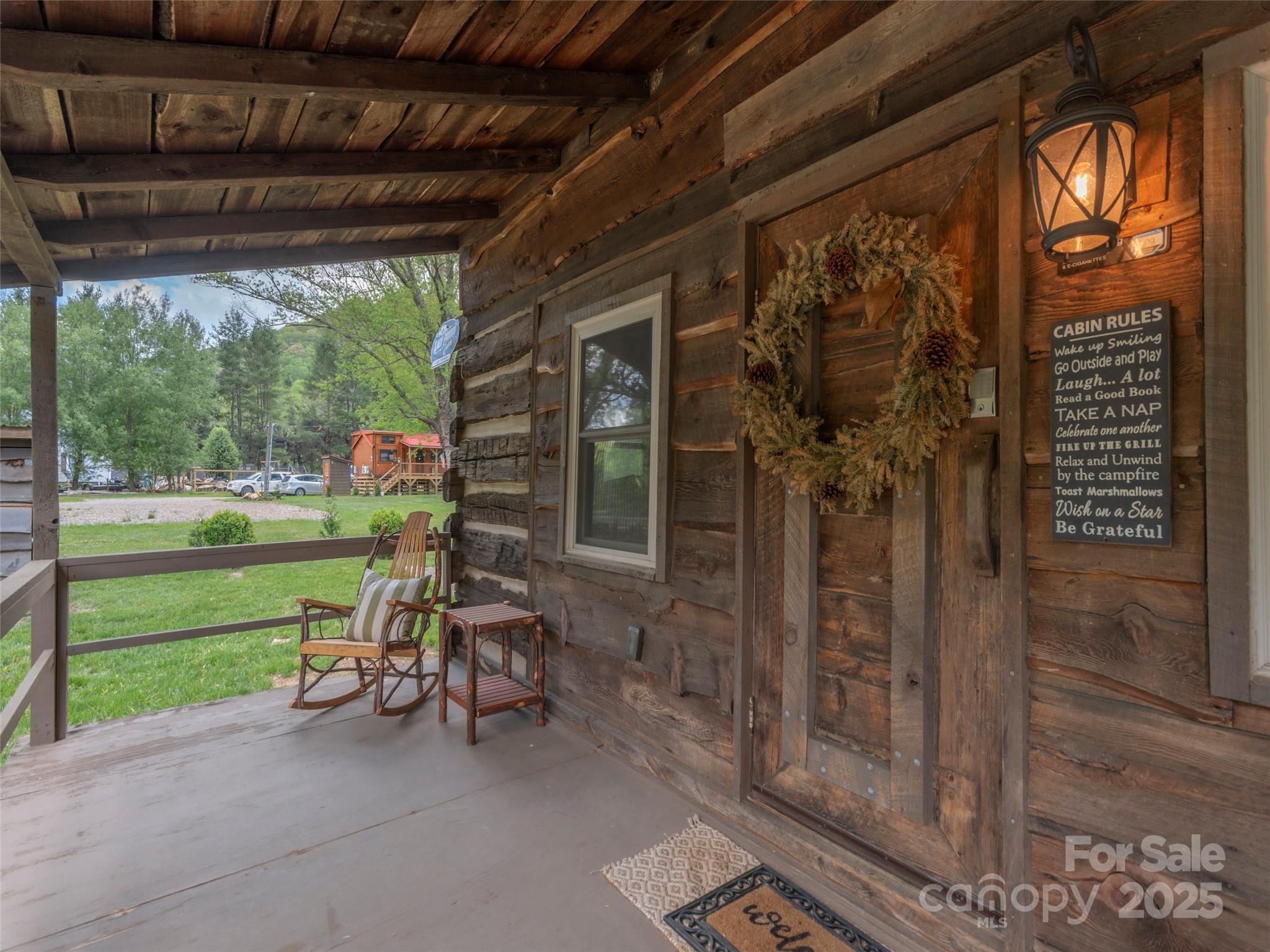 9386 Cruso Road Canton, NC 28716 - Photo 6 of 40 a view of a porch with furniture and yard