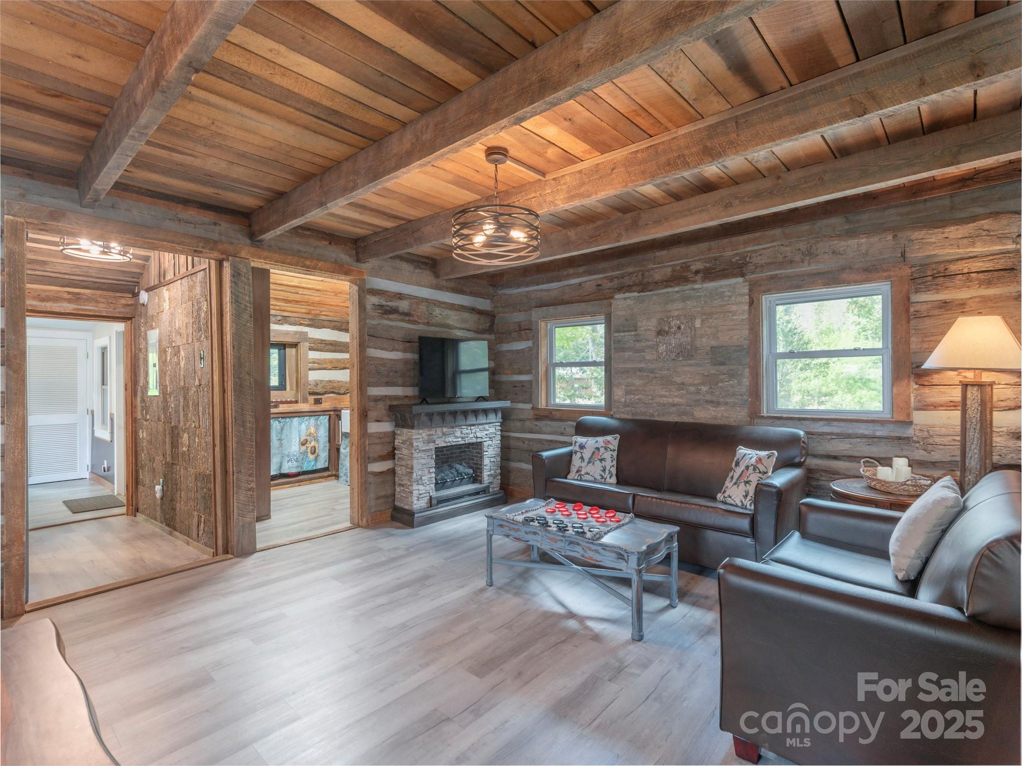 9386 Cruso Road Canton, NC 28716 - Photo 7 of 40 a living room with furniture and a flat screen tv