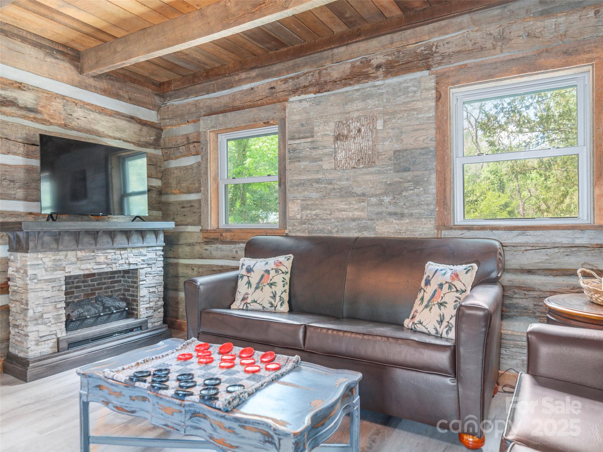 9386 Cruso Road Canton, NC 28716 - Photo 9 of 40 a living room with furniture and a fireplace