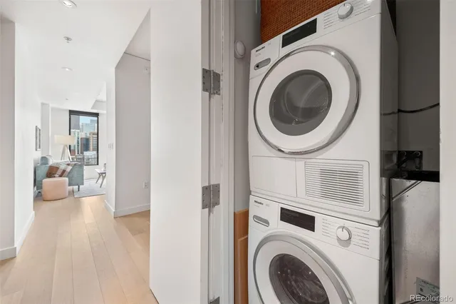 a view of a hallway with washer and dryer