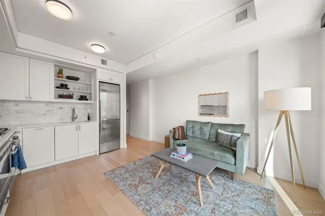 a living room with furniture and a rug