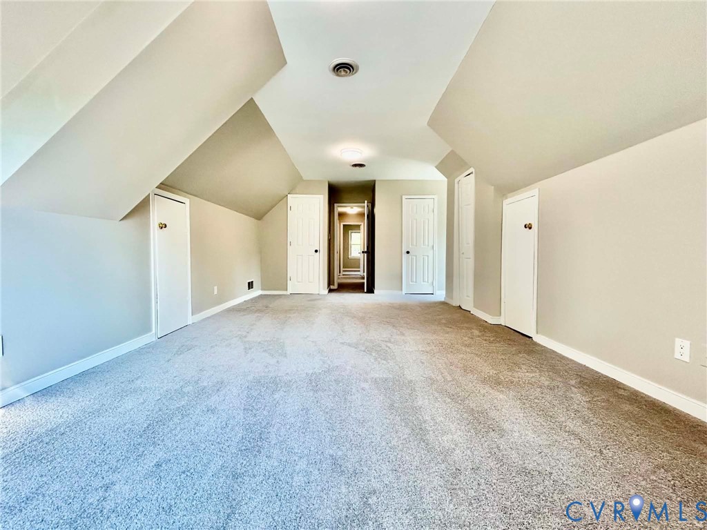 7110 Manning Road Chesterfield, VA 23832 - Photo 44 of 50 Spacious room featuring sloped ceilings, light gra