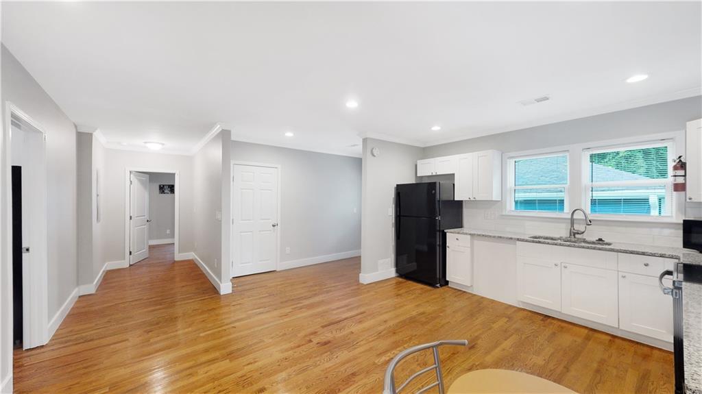 1333 Campbellton Road Southwest Atlanta, GA 30310 - Photo 10 of 21 a large kitchen with a refrigerator and a sink