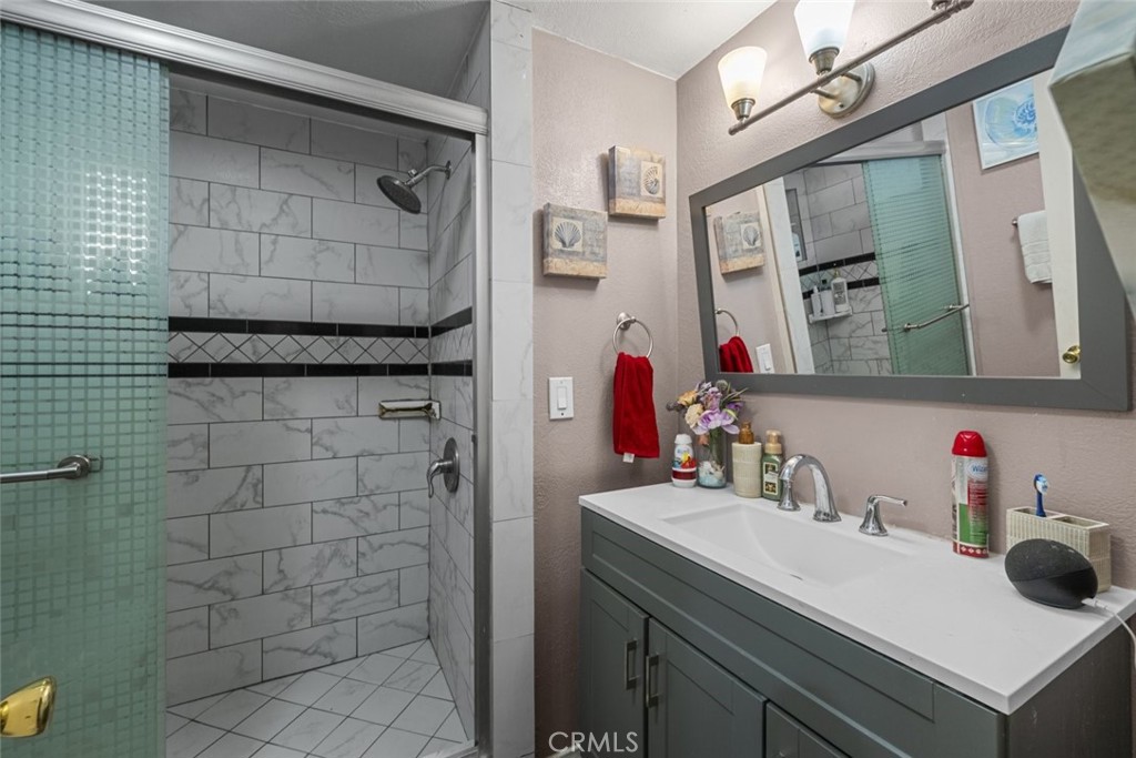 3255 East Avenue R, Unit 34 Palmdale, CA 93550 - Photo 19 of 32 a bathroom with a sink and a mirror