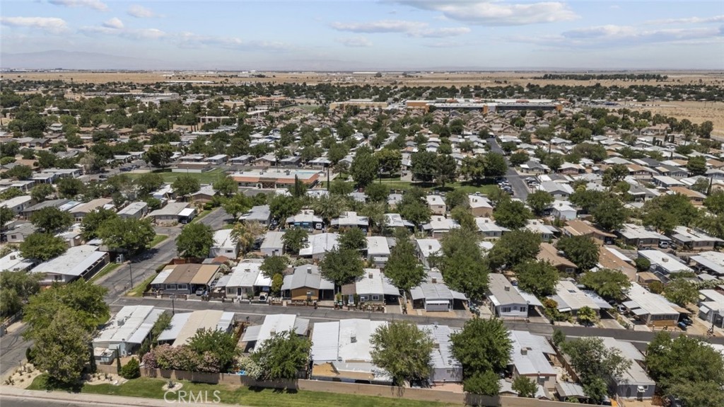 3255 East Avenue R, Unit 34 Palmdale, CA 93550 - Photo 2 of 32 an aerial view of a city with lots of residential buildings