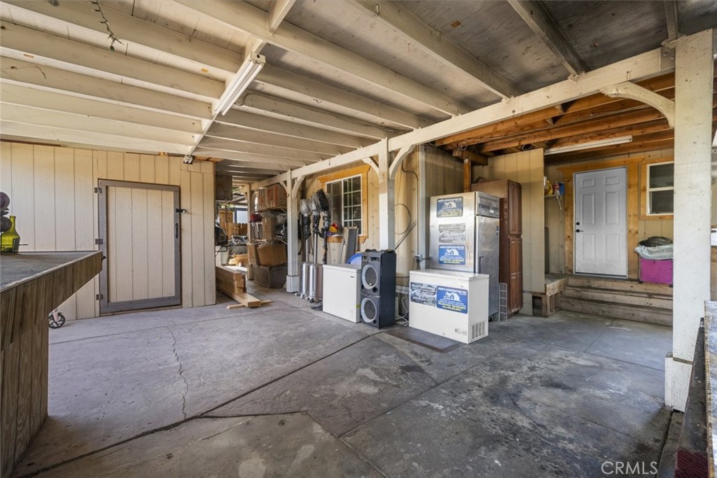 3255 East Avenue R, Unit 34 Palmdale, CA 93550 - Photo 22 of 32 a view of a hallway with wooden shelves