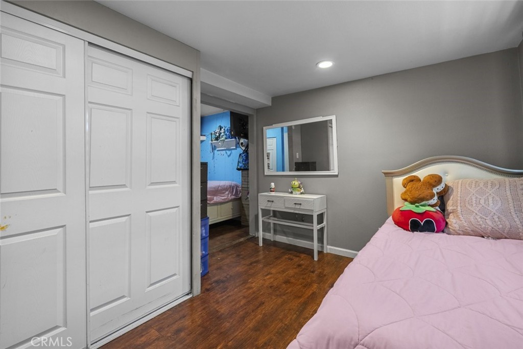 3255 East Avenue R, Unit 34 Palmdale, CA 93550 - Photo 26 of 32 a bedroom with a bed and a closet