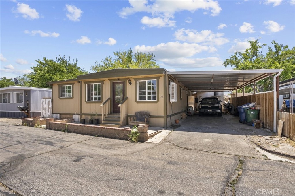 3255 East Avenue R, Unit 34 Palmdale, CA 93550 - Photo 32 of 32 a view of a house with a patio