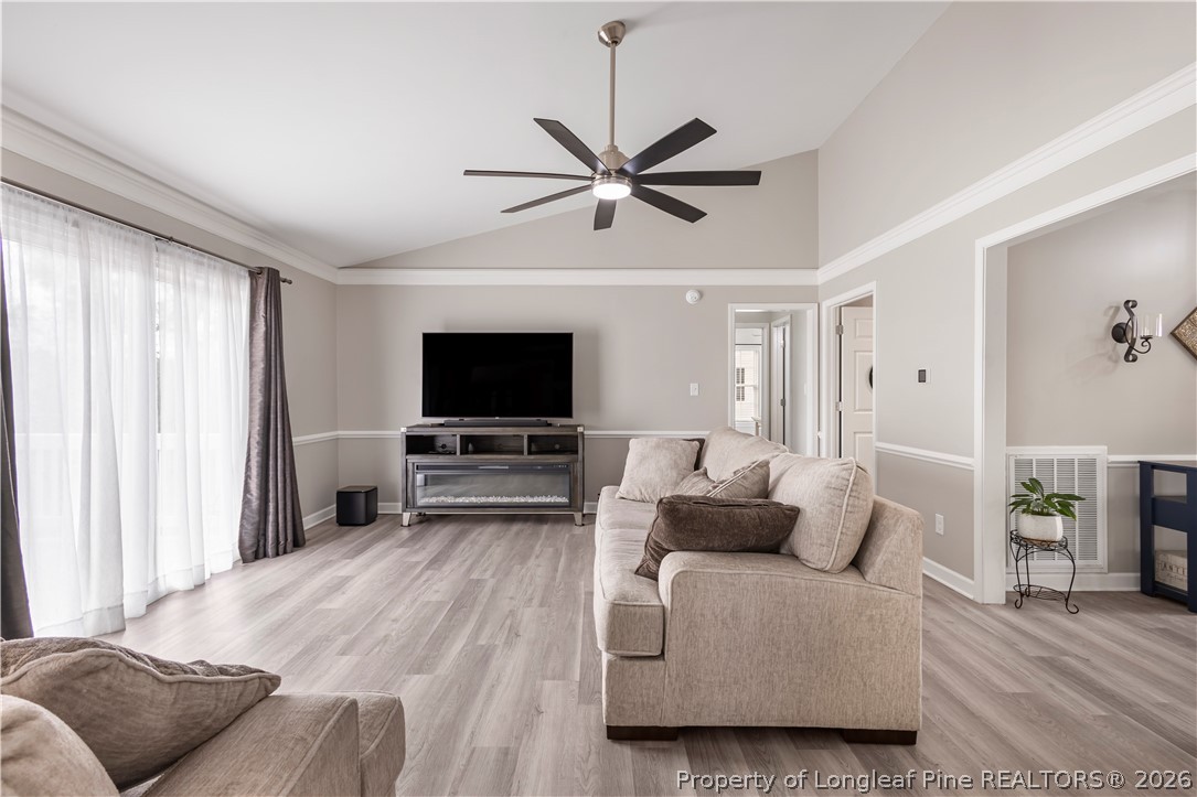 253 Farmstead Court Rockingham, NC 28379 - Photo 11 of 25 a living room with furniture and a flat screen tv