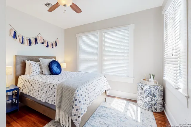 a bedroom with a bed and a window