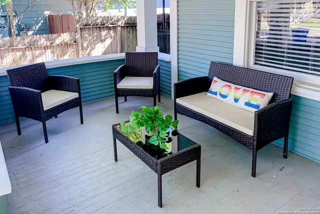 a outdoor living space with furniture and a potted plant