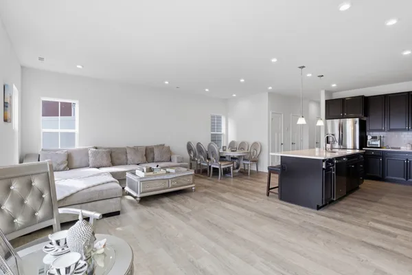 a large kitchen with stainless steel appliances lots of counter top space