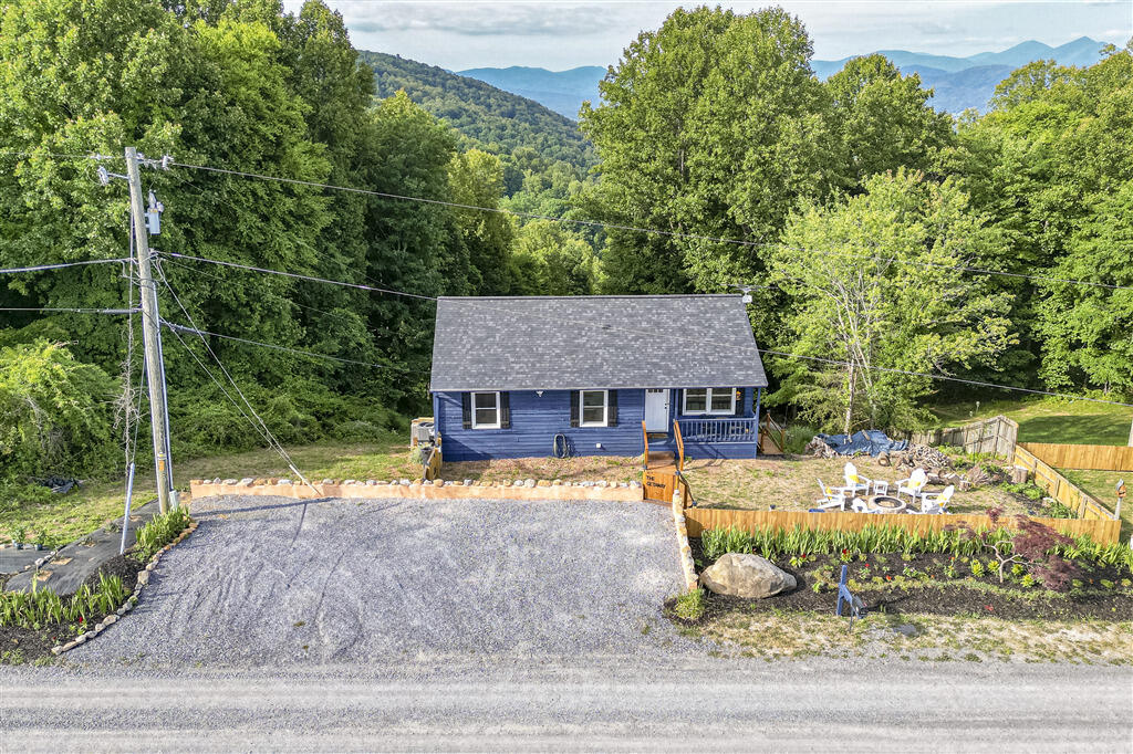 1039 Fosters Knob Road Blue Ridge, VA 24064 - Photo 34 of 45 a front view of a house with garden