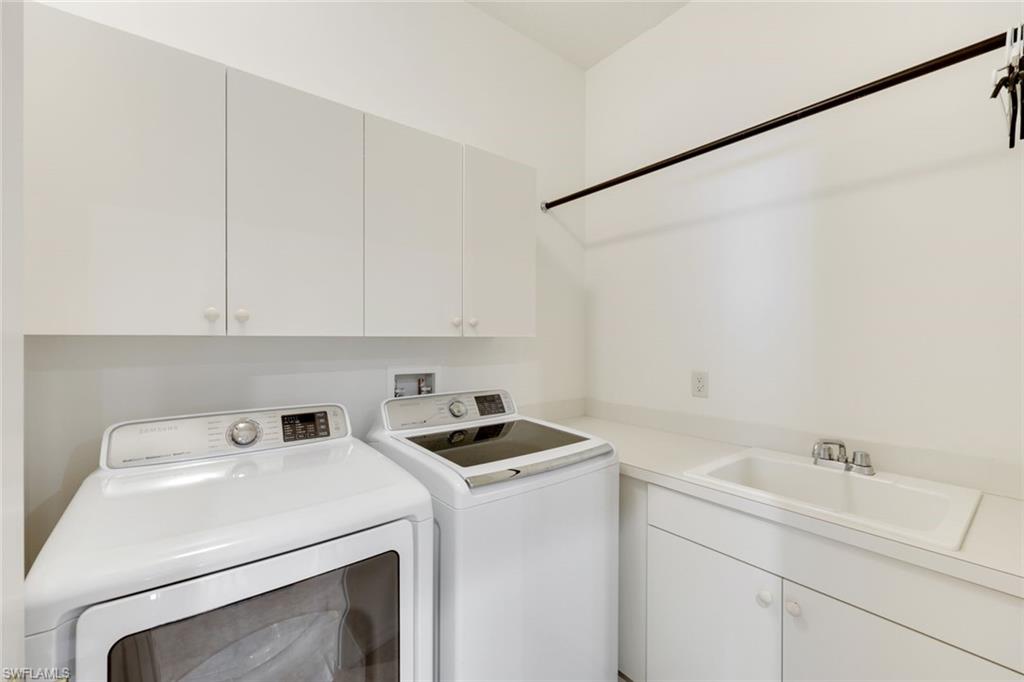 3530 Lansing Loop, Unit 202 Estero, FL 33928 - Photo 25 of 35 a utility room with dryer and washer