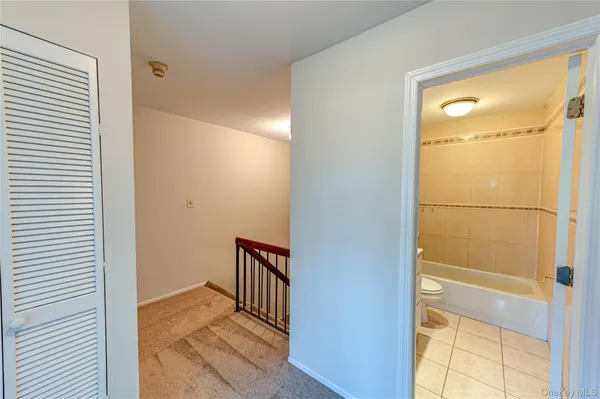 a view of a hallway with a door