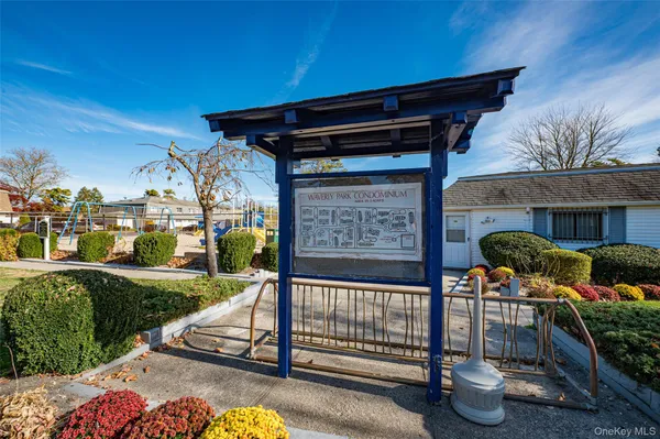 a view of a porch with furniture and a yard