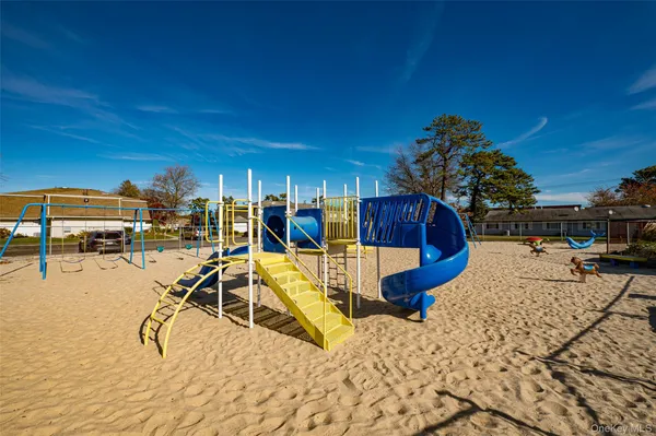a view of a swimming pool with outdoor seating