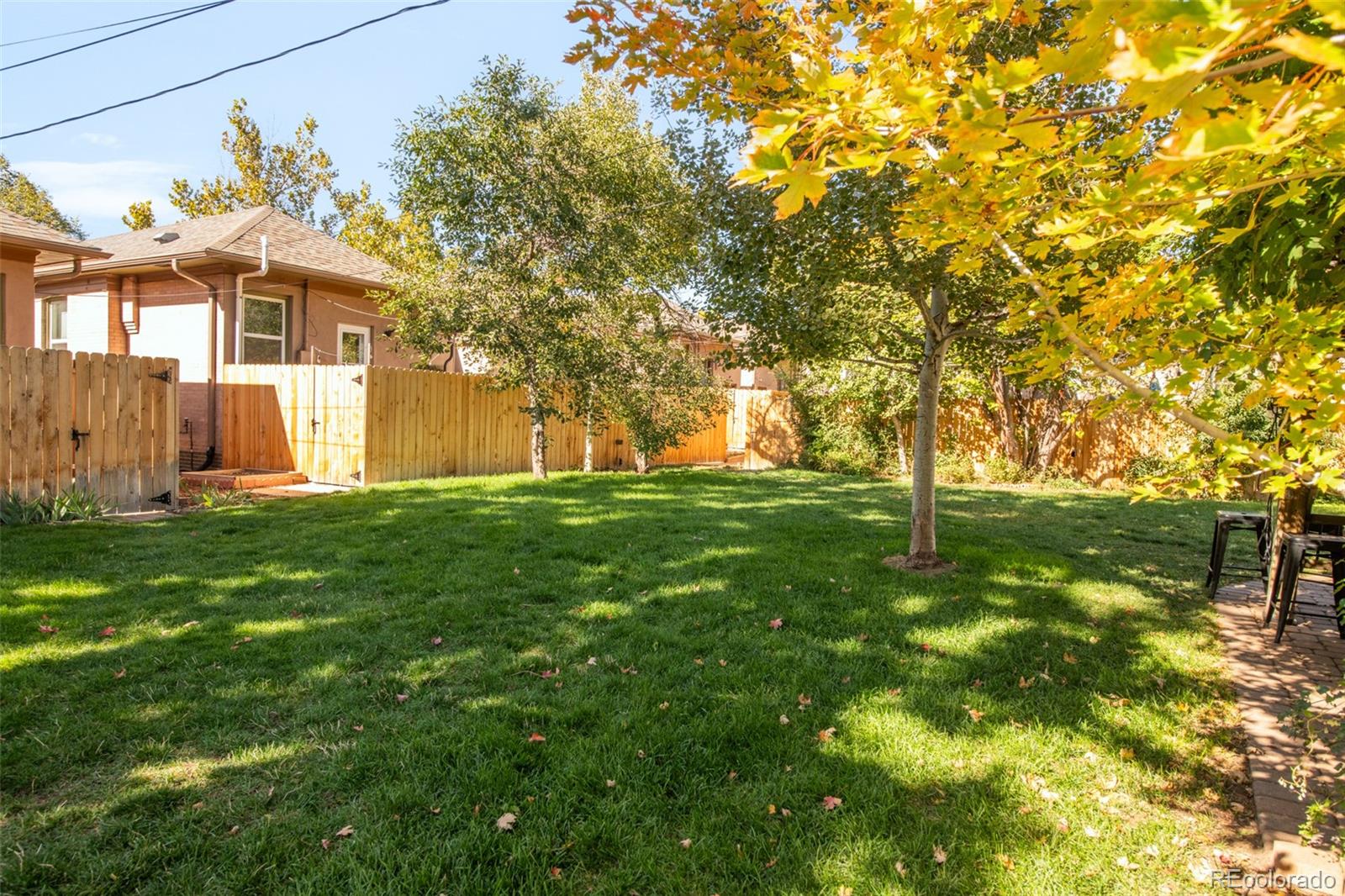 3244 Clay Street Denver, CO 80211 - Photo 24 of 28 a front view of a house with a yard