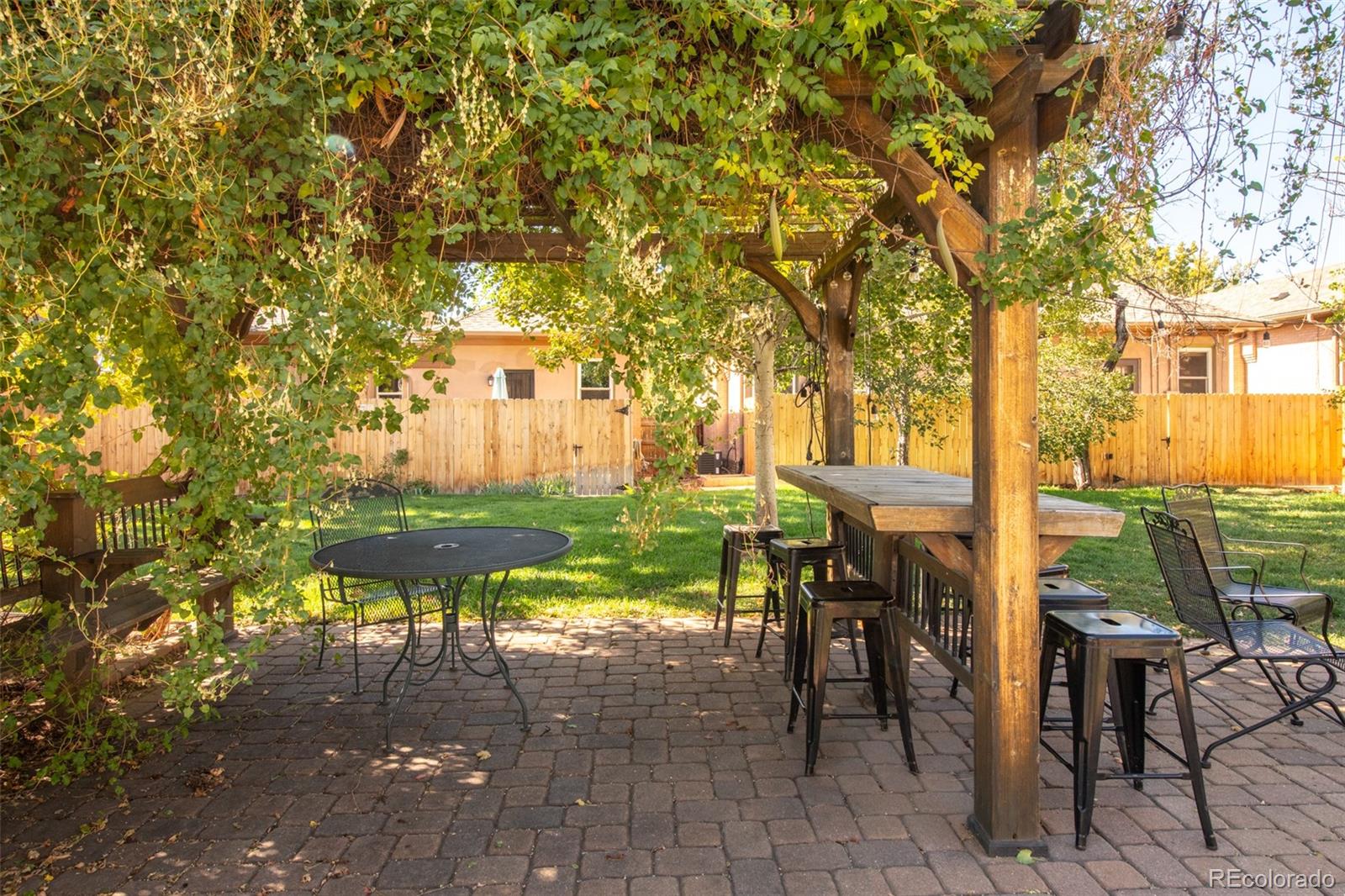 3244 Clay Street Denver, CO 80211 - Photo 27 of 28 a front view of a house with a yard