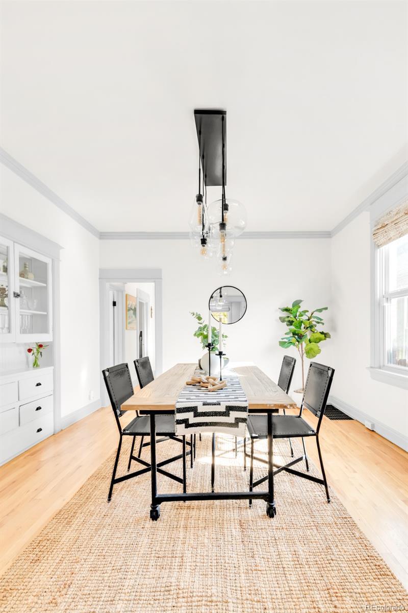 3244 Clay Street Denver, CO 80211 - Photo 7 of 28 a dining room with furniture and wooden floor