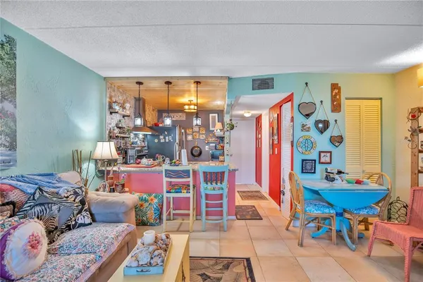 a bedroom with furniture and a large window