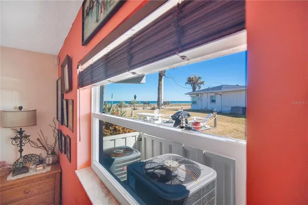 a view of an chairs and tables in patio